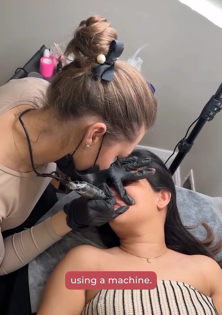 Certified PMU trainer teaching eyebrow shading techniques at Victoria Studio Toronto